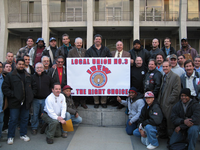Local 3 Members Displaying Banner
